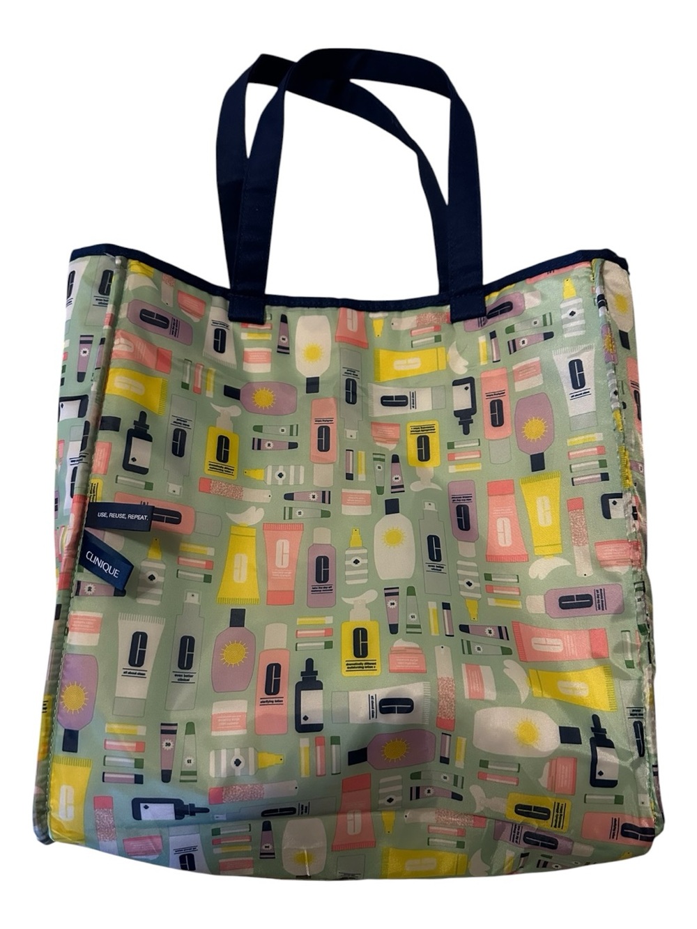 Kate Spade+Clinique Reversible Tote, Make Up Bag & .5oz Moisture Surge Intense - Picture 5 of 14